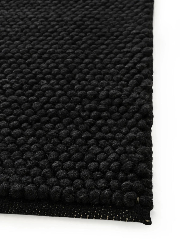 Tapis moderne uni noir charbon en laine 120x170 cm
