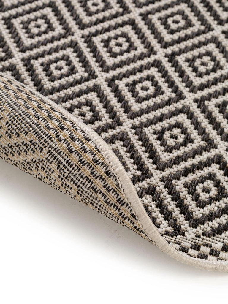 Tapis ethnique motif géométrique rond blanc et noir d'intérieur et d'extérieur 120 cm de diamètre