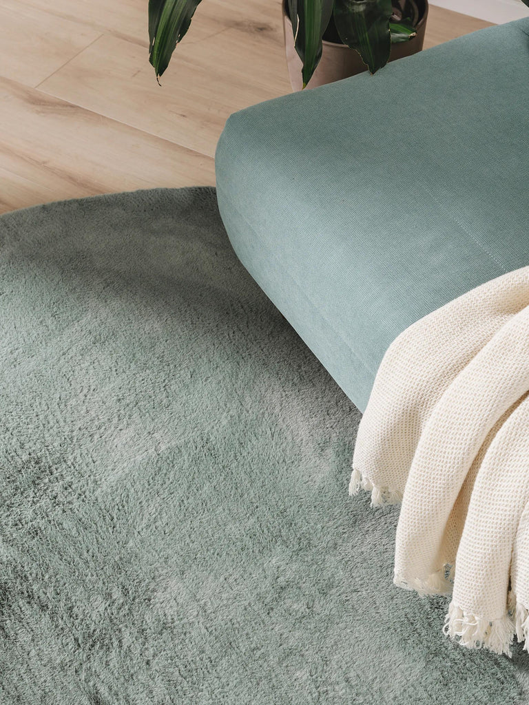 Tapis moderne fausse fourrure rond vert d'eau 120 cm de diamètre