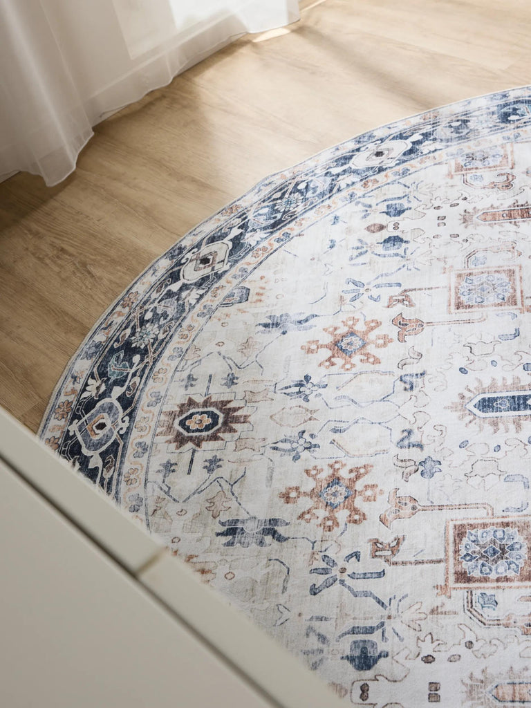 Tapis vintage motif ethnique rond blanc et bleu lavable 120 cm de diamètre