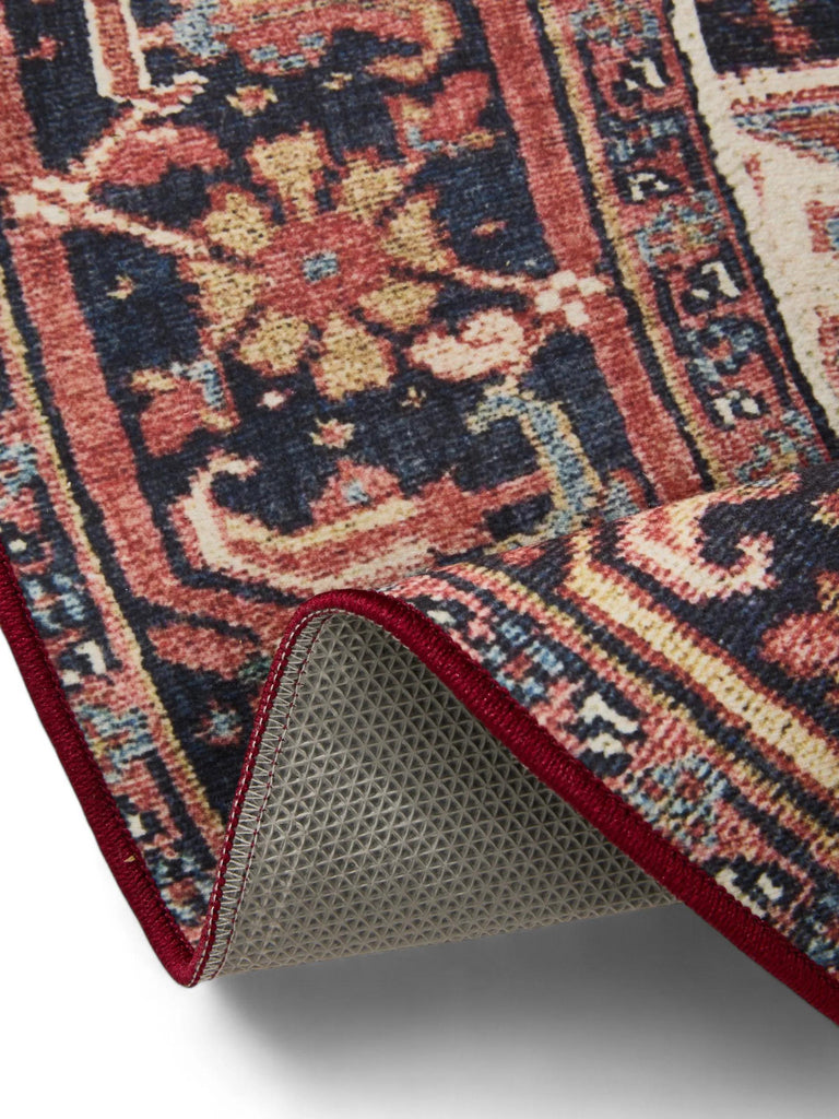 Tapis oriental rond multicolore tons rouges lavable 160 cm de diamètre