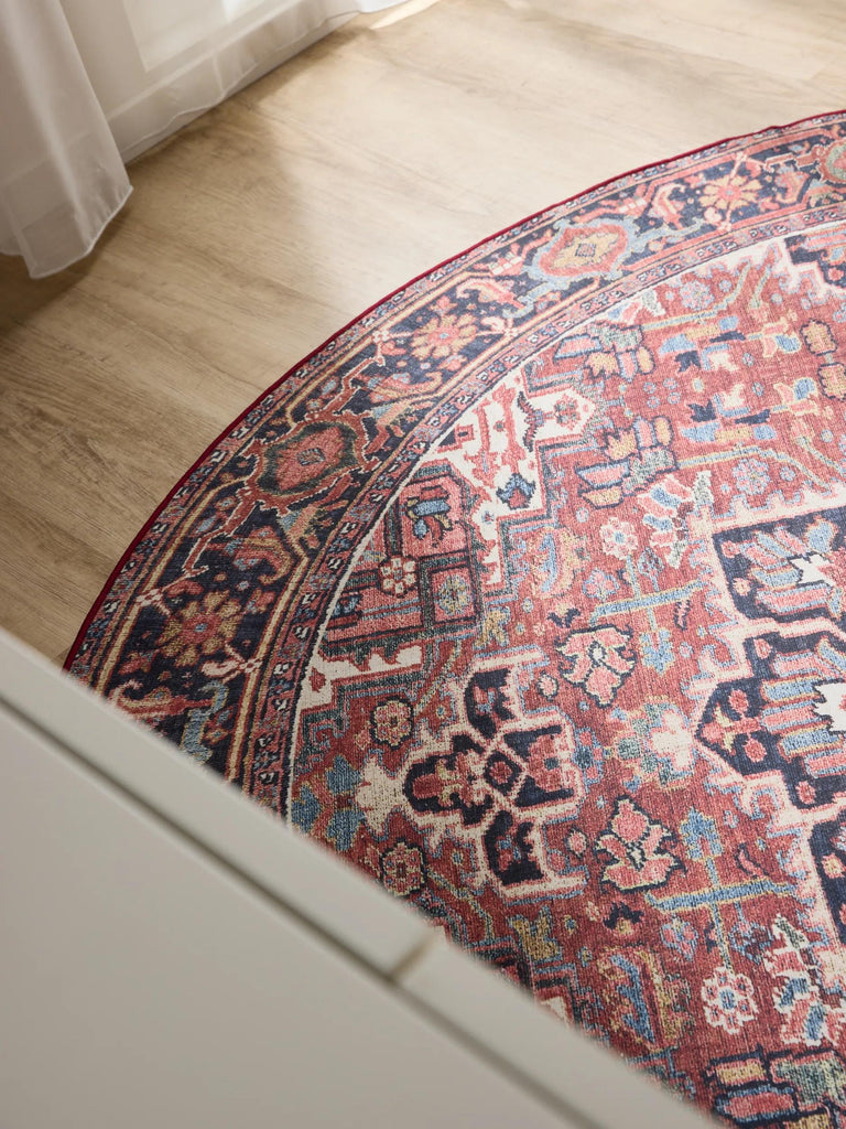 Tapis oriental rond multicolore tons rouges lavable 160 cm de diamètre