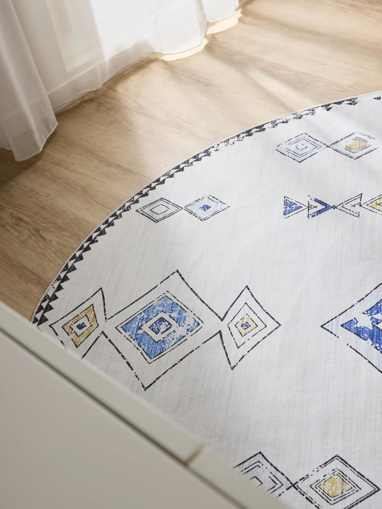 Tapis ethnique inspiration berbère rond beige et bleu lavable 120 cm de diamètre