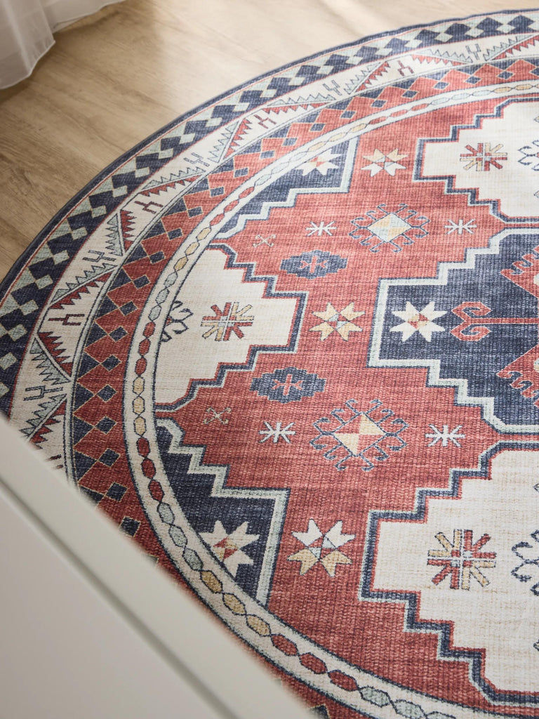 Tapis ethnique inspiration oriental rond rouge et beige lavable 160 cm de diamètre