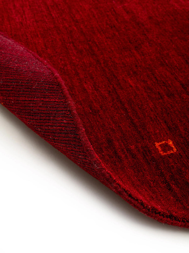 Tapis moderne motif ethnique rond bordeaux en laine 160 cm de diamètre