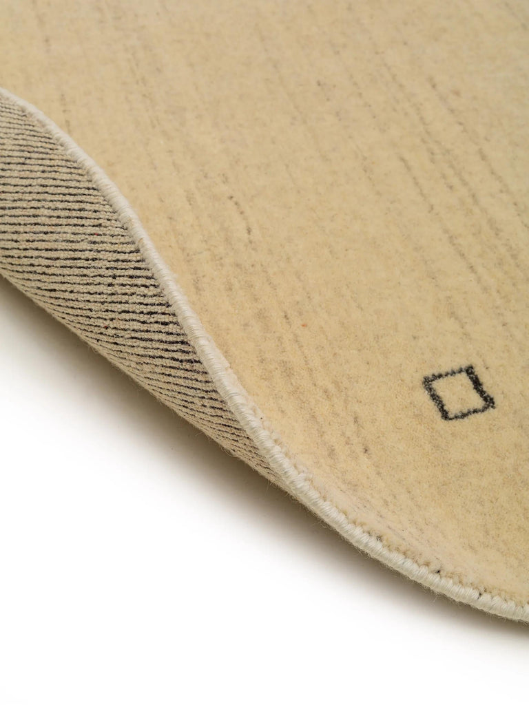 Tapis moderne motif ethnique rond beige en laine 160 cm de diamètre