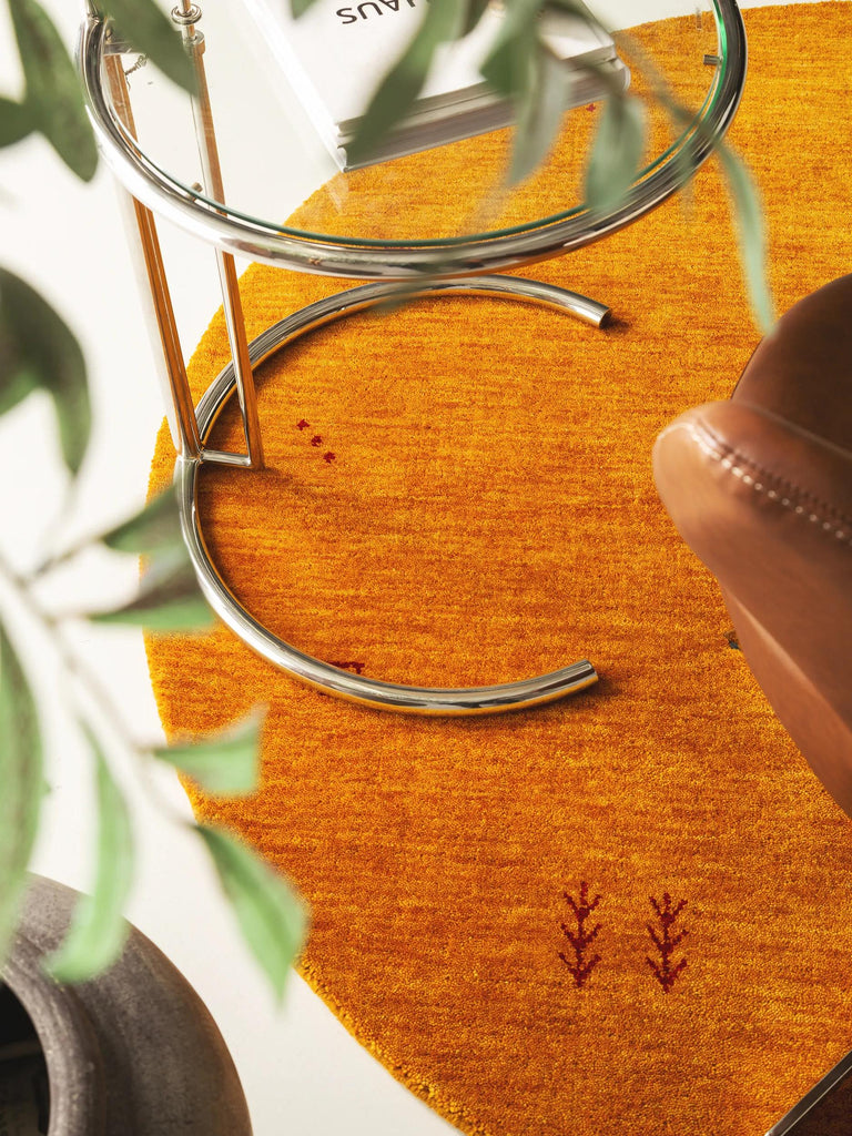 Tapis moderne motif ethnique rond orange en laine 160 cm de diamètre