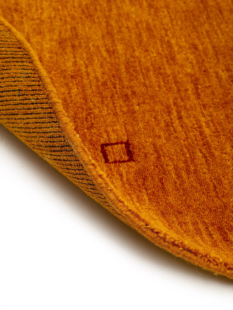 Tapis moderne motif ethnique rond orange en laine 160 cm de diamètre