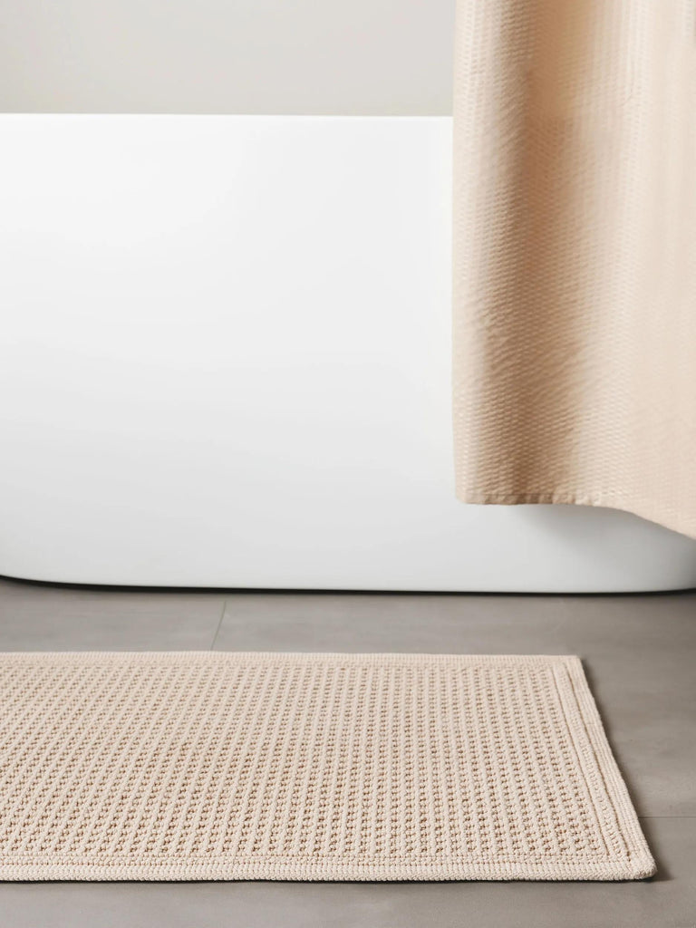 Tapis géométrique grille de bain beige en coton 50x80 cm
