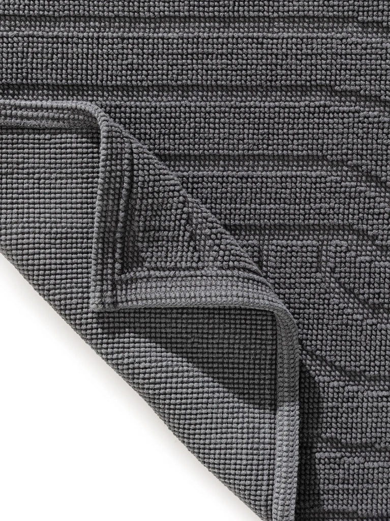 Tapis géométrique spirale de bain noir en coton 50x80 cm