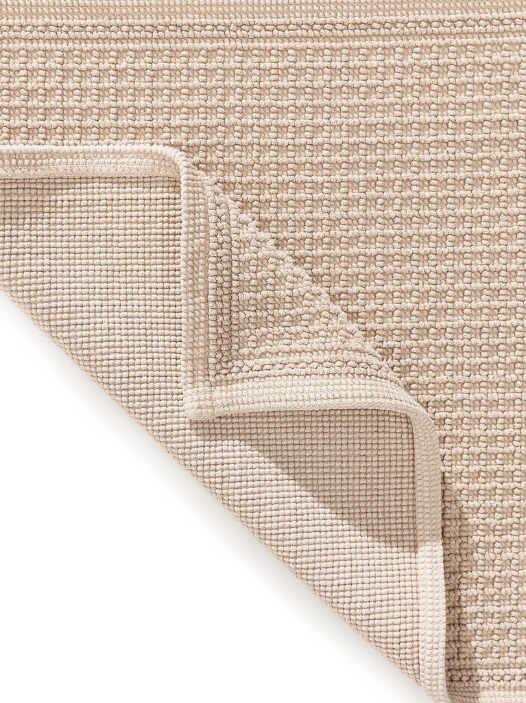 Tapis géométrique grille de bain beige en coton 50x80 cm