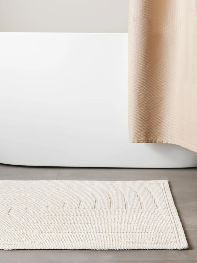 Tapis géométrique spirale de bain crème en coton 50x80 cm