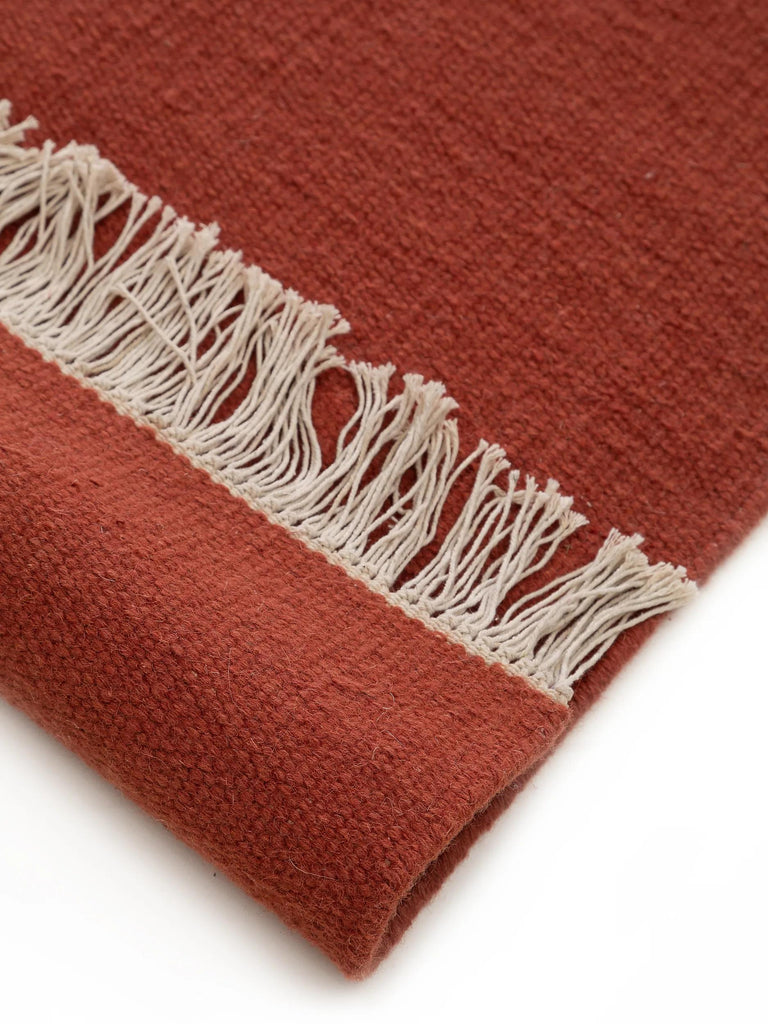 Tapis scandinave uni à franges rouge brique en laine 200x300 cm