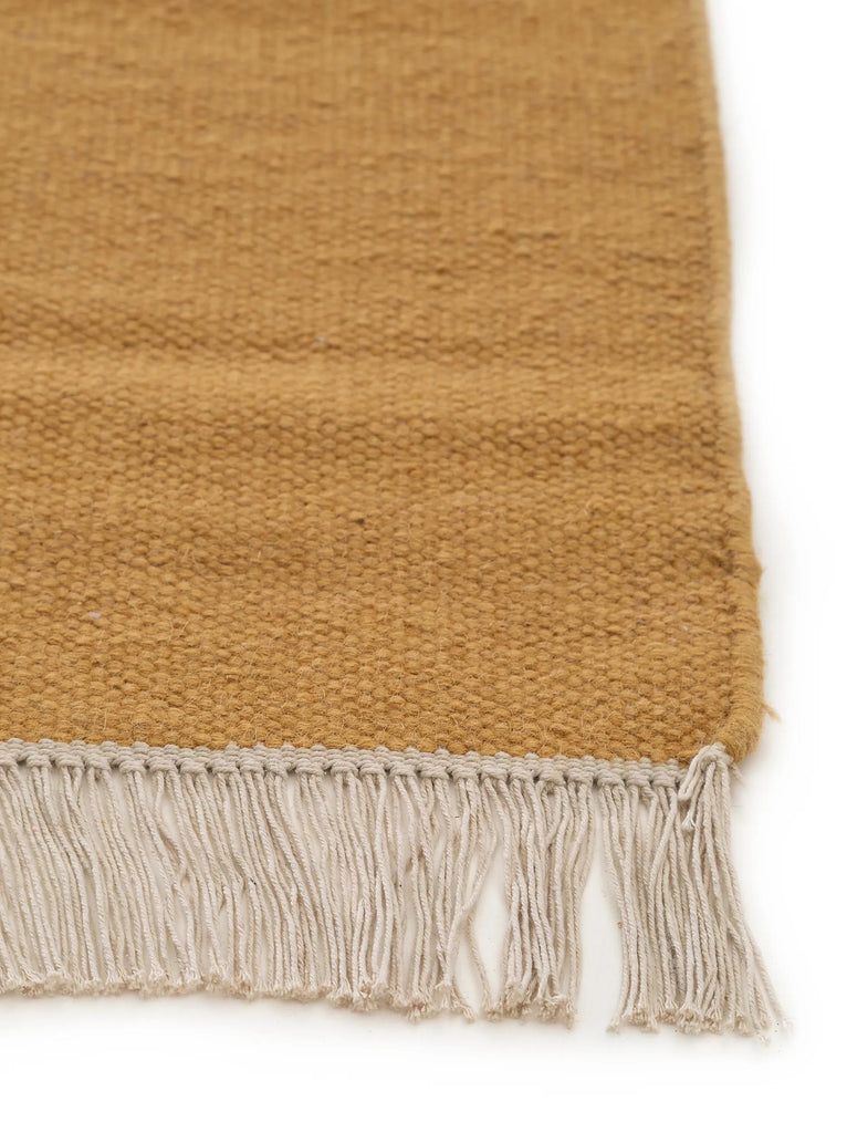 Tapis scandinave uni à franges terracotta en laine 60x100 cm