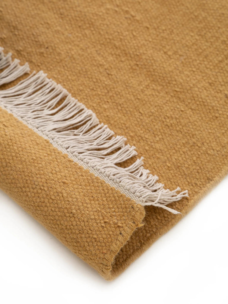 Tapis scandinave uni à franges terracotta en laine 60x100 cm