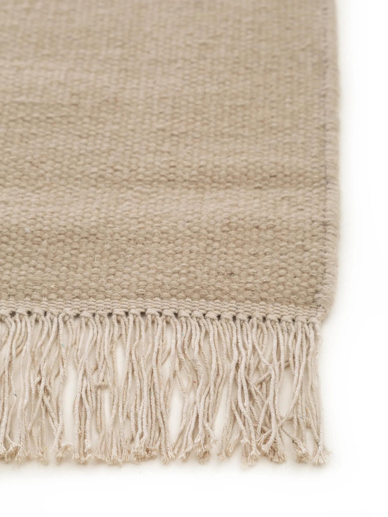 Tapis scandinave uni à franges beige en laine 60x100 cm