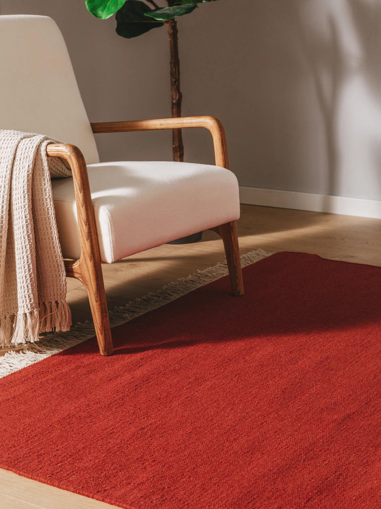 Tapis scandinave uni à franges rouge brique en laine 120x170 cm