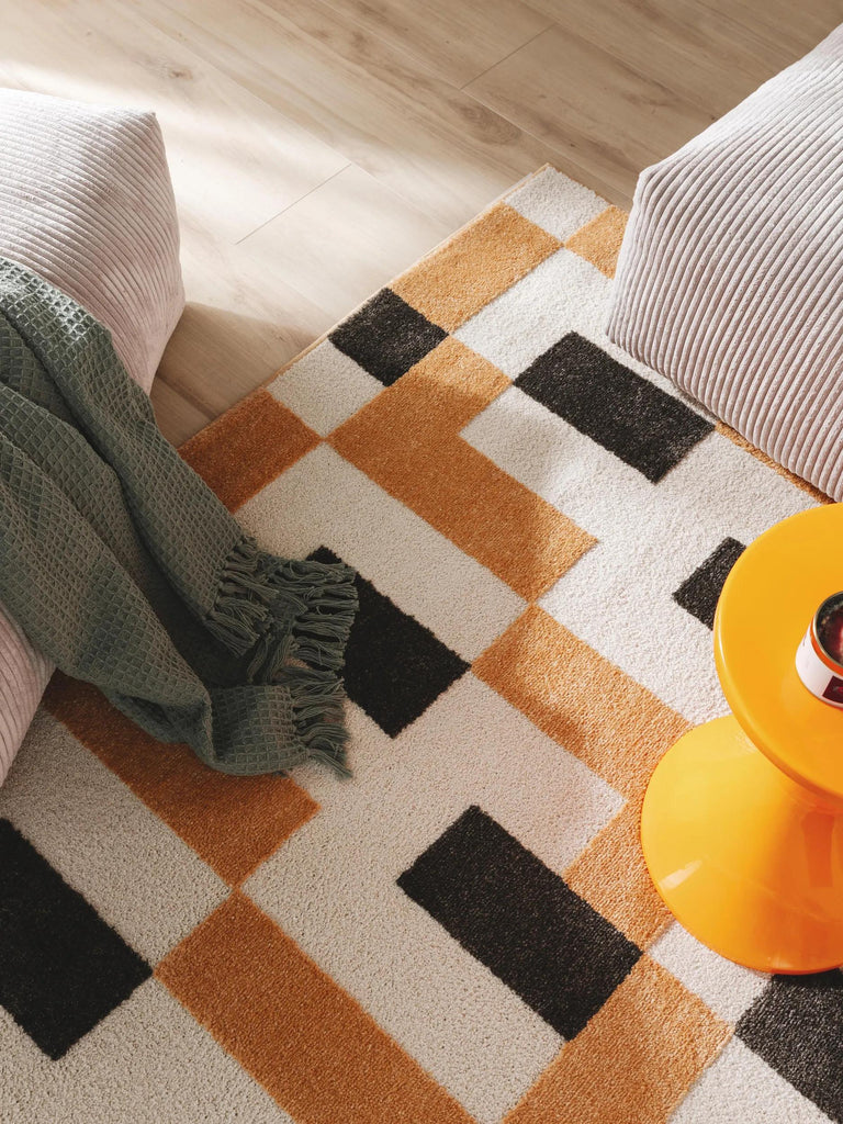 Tapis géométrique moderne blanc orange et noir 120x170 cm