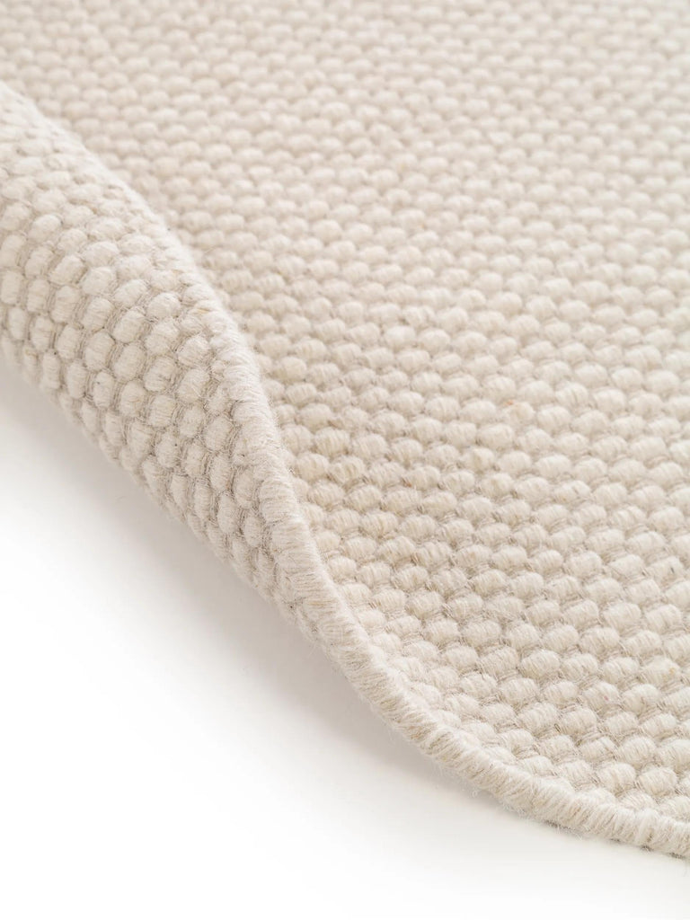 Tapis scandinave uni rond blanc en laine 100 cm de diamètre