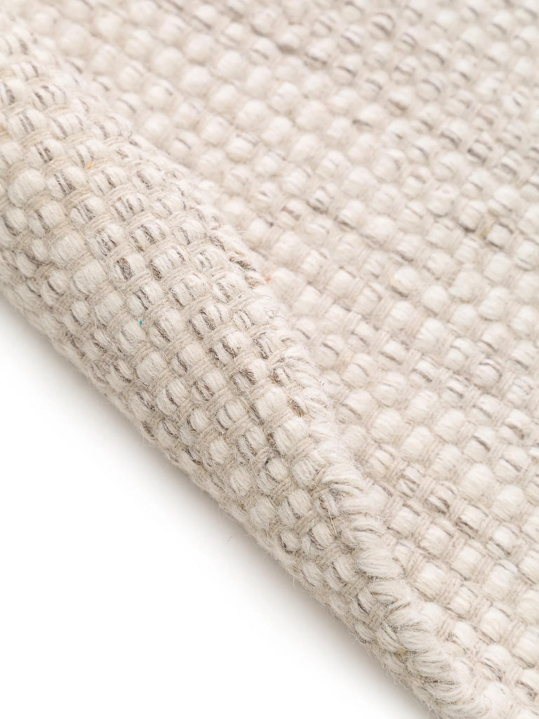 Tapis scandinave chiné rond crème en laine 150 cm de diamètre