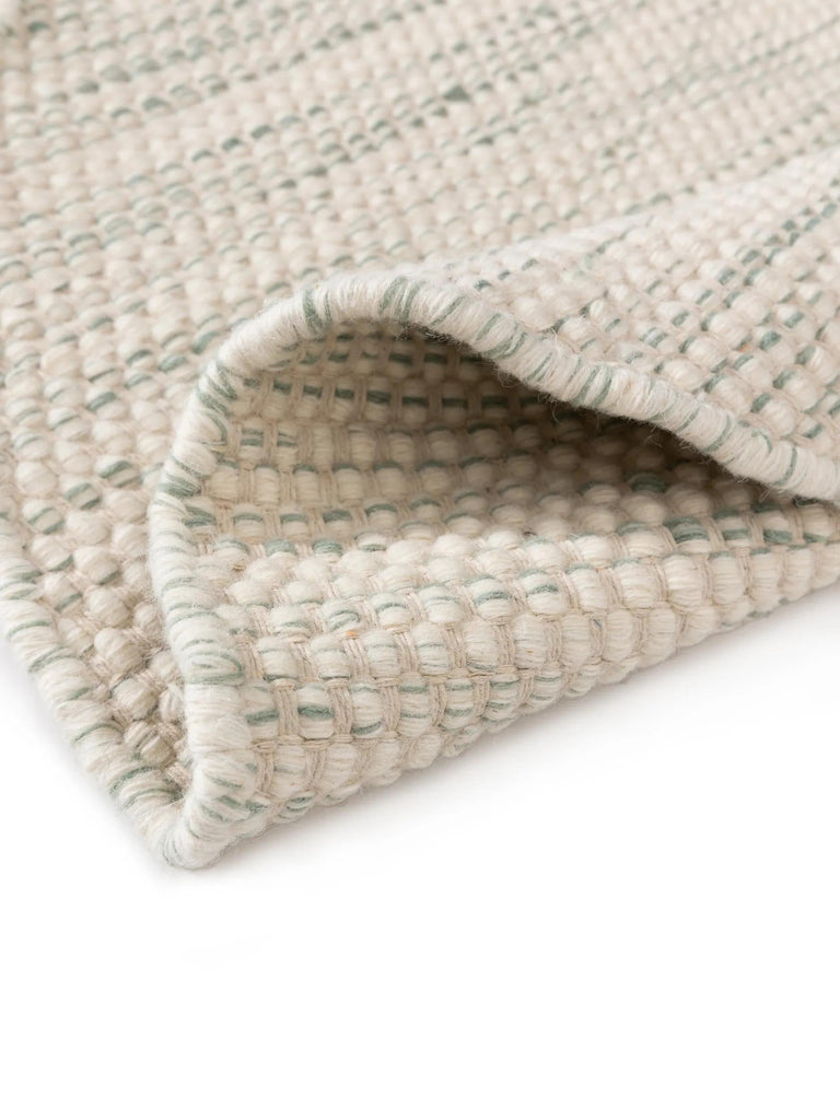 Tapis scandinave tressé rond enfant crème et gris en laine 100 cm de diamètre