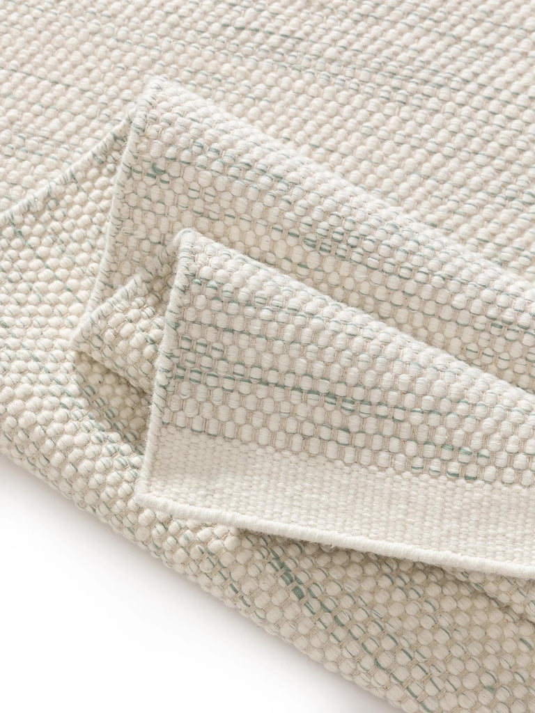 Tapis scandinave tressé enfant crème et gris en laine 90x130 cm