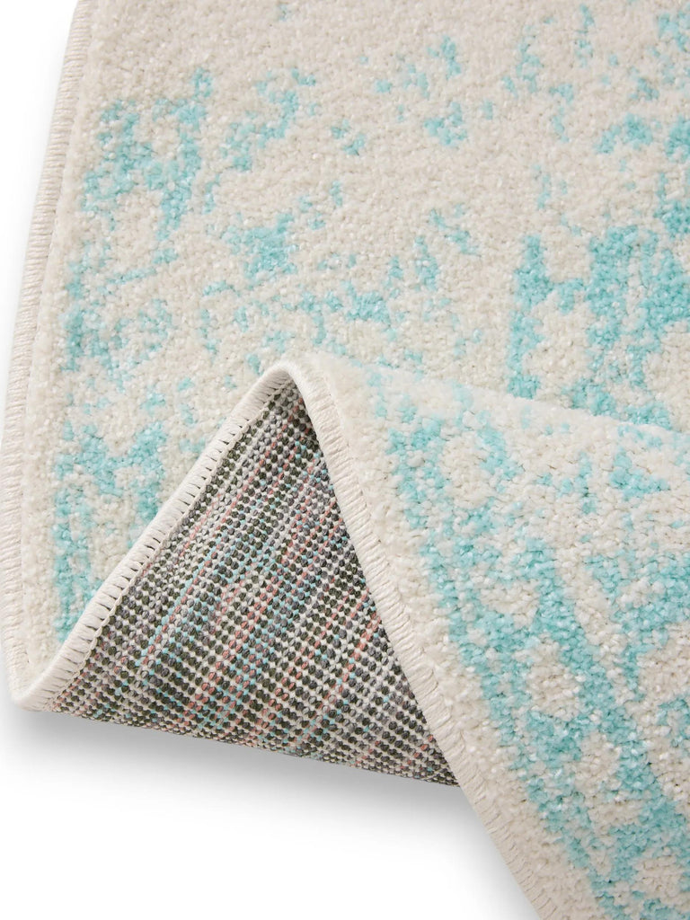 Tapis vintage motif oriental rond blanc et turquoise 120 cm de diamètre