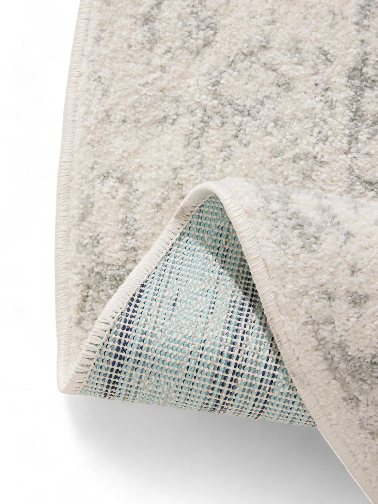 Tapis vintage motif oriental rond blanc et vert clair 160 cm de diamètre