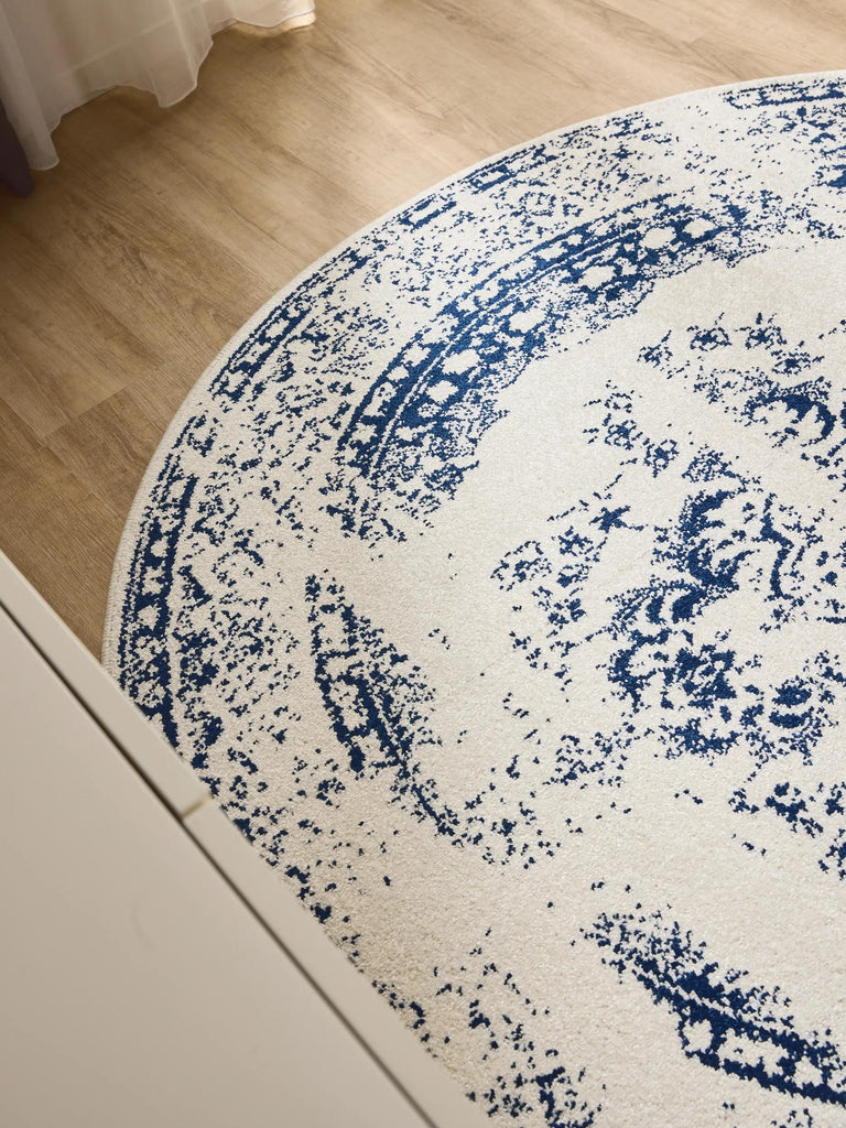 Tapis vintage motif oriental rond blanc et bleu foncé 120 cm de diamètre