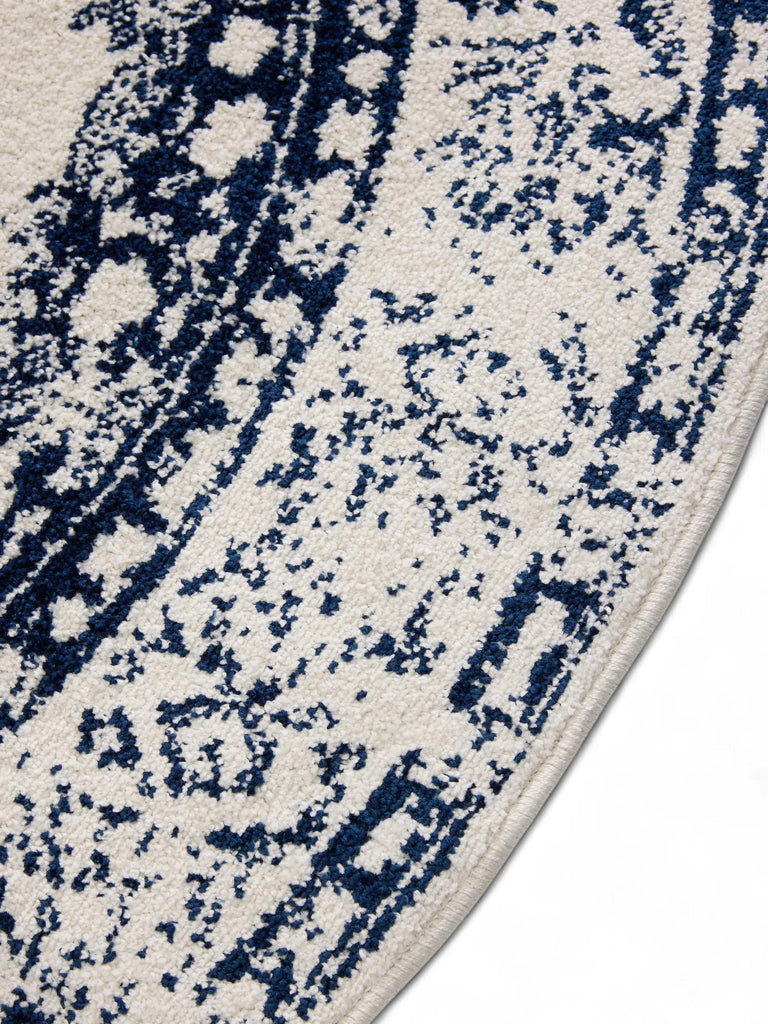 Tapis vintage motif oriental rond blanc et bleu foncé 160 cm de diamètre