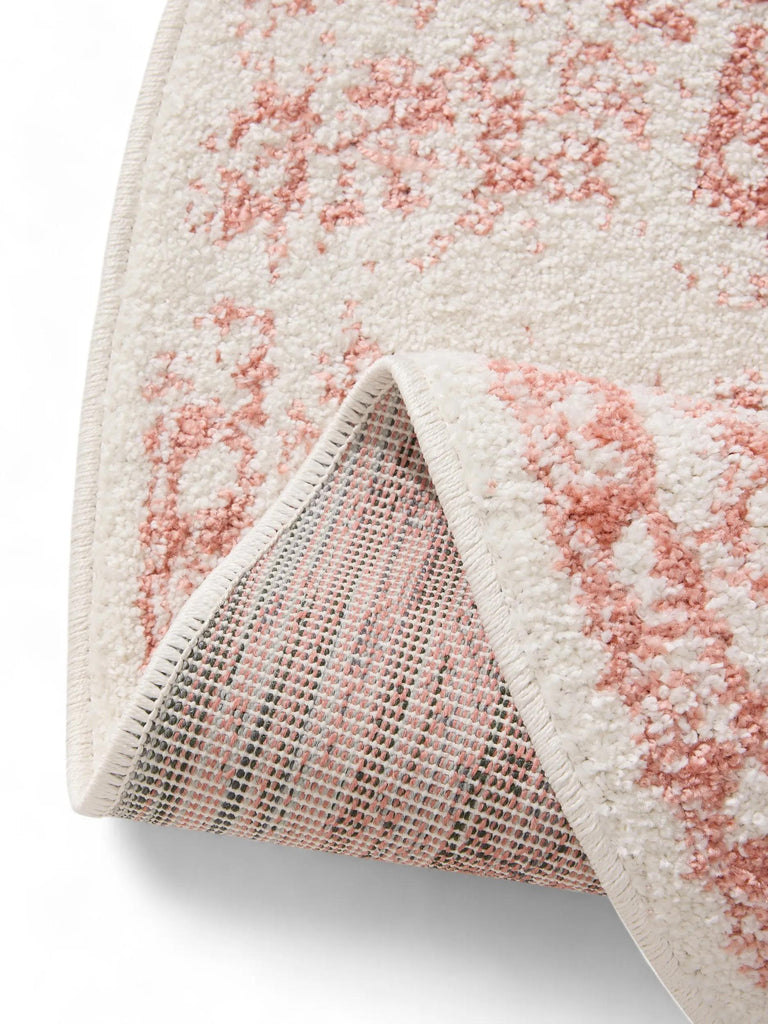 Tapis vintage motif oriental rond blanc et terracotta 120 cm de diamètre