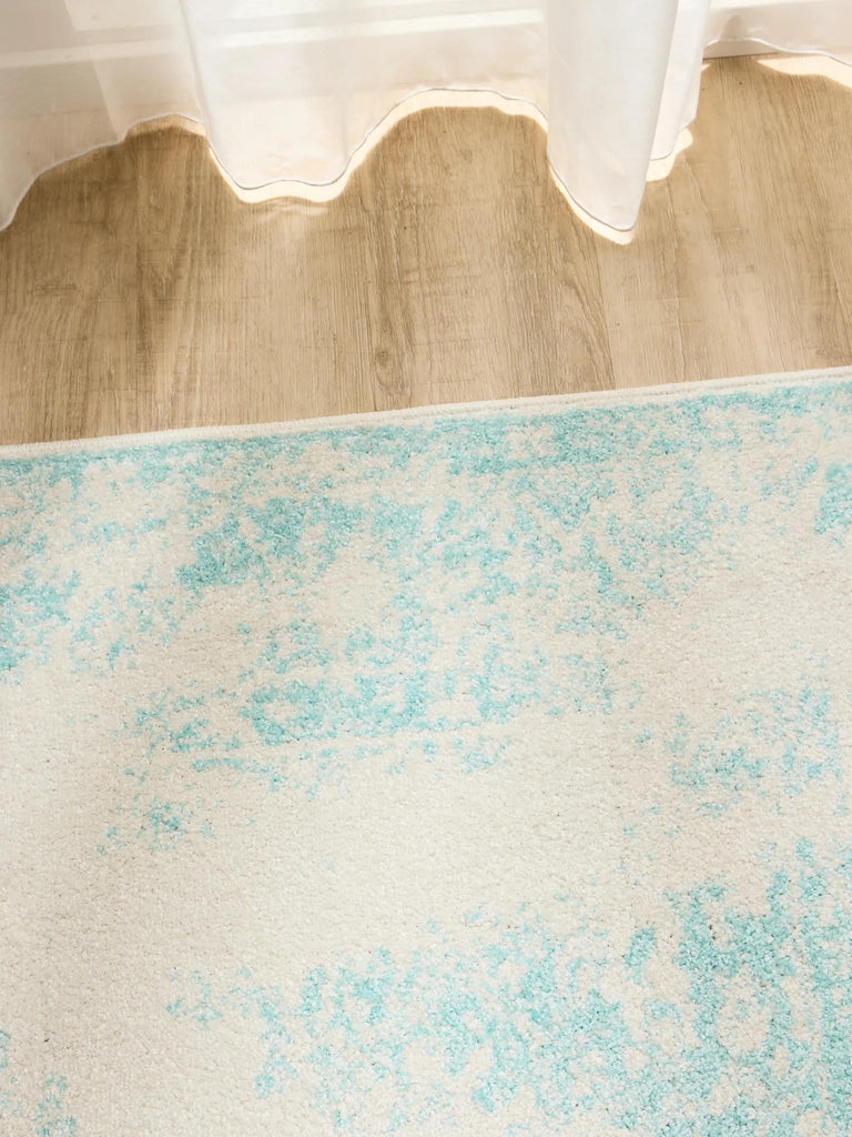 Tapis vintage motif oriental blanc et turquoise 60x120 cm