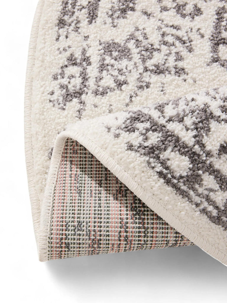 Tapis vintage motif oriental rond beige et gris 160 cm de diamètre