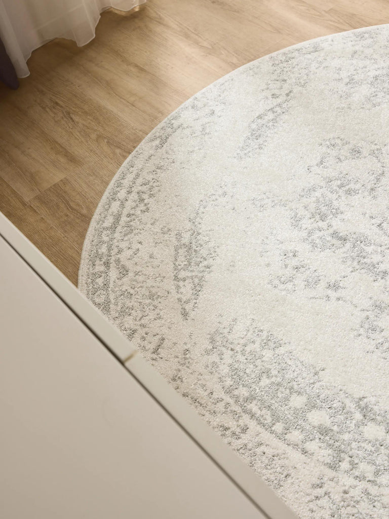 Tapis vintage motif oriental rond blanc et vert clair 120 cm de diamètre