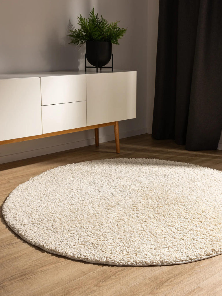 Tapis moderne uni poils longs frisés rond crème lavable 120 cm de diamètre