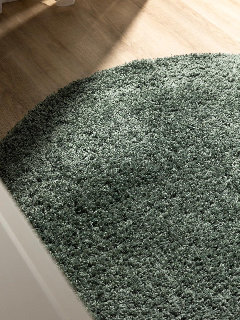 Tapis moderne uni poils longs frisés rond vert lavable 80 cm de diamètre