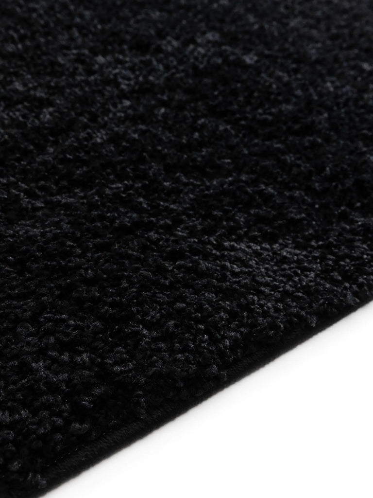 Tapis moderne uni poils longs frisés noir lavable 120x170 cm