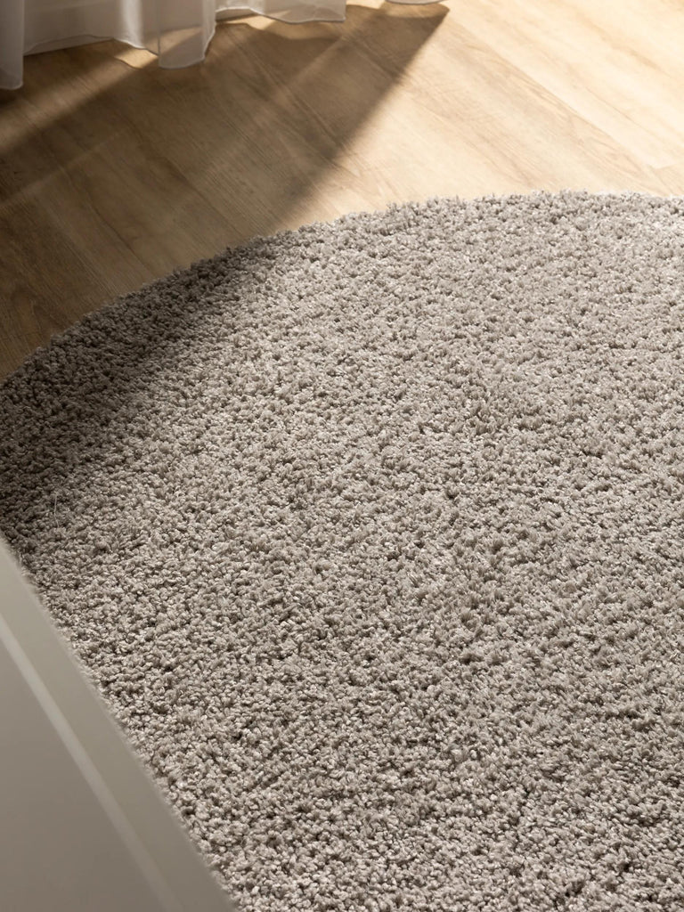 Tapis moderne uni poils longs frisés rond gris lavable 120 cm de diamètre