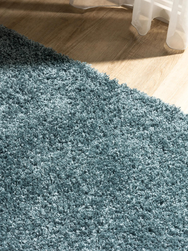 Tapis moderne uni poils longs frisés bleu pétrole lavable 160x230 cm