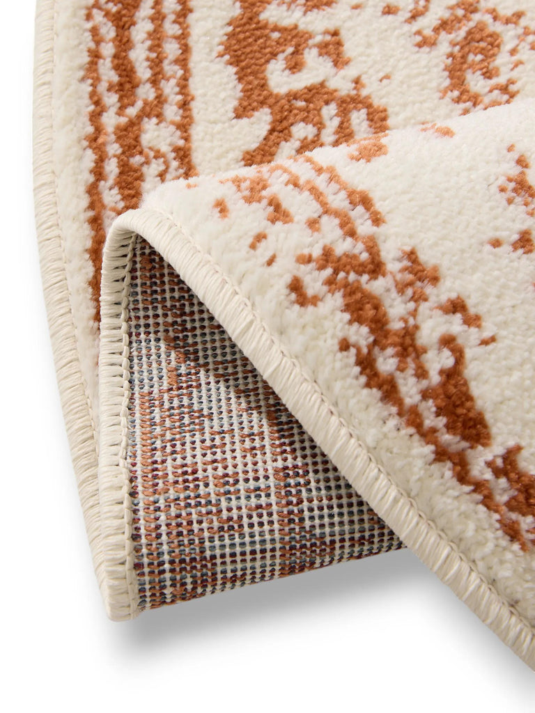 Tapis vintage motif floral rond crème et terracotta 160 cm de diamètre