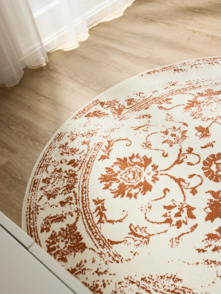 Tapis vintage motif floral rond crème et terracotta 160 cm de diamètre