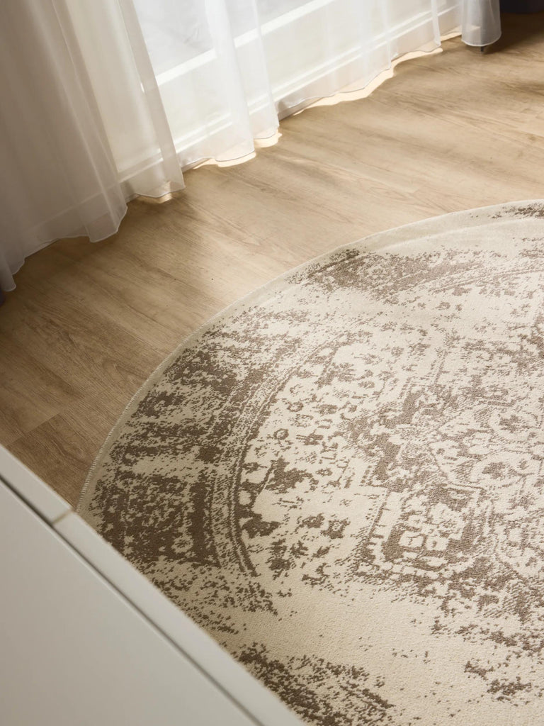 Tapis vintage oriental rond crème et marron 160 cm de diamètre