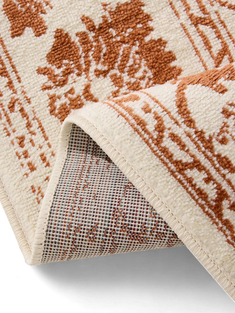 Tapis vintage motif floral crème et terracotta 80x150 cm