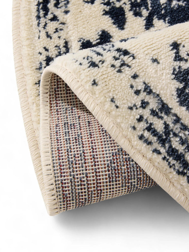 Tapis vintage motif floral rond beige et bleu 120 cm de diamètre