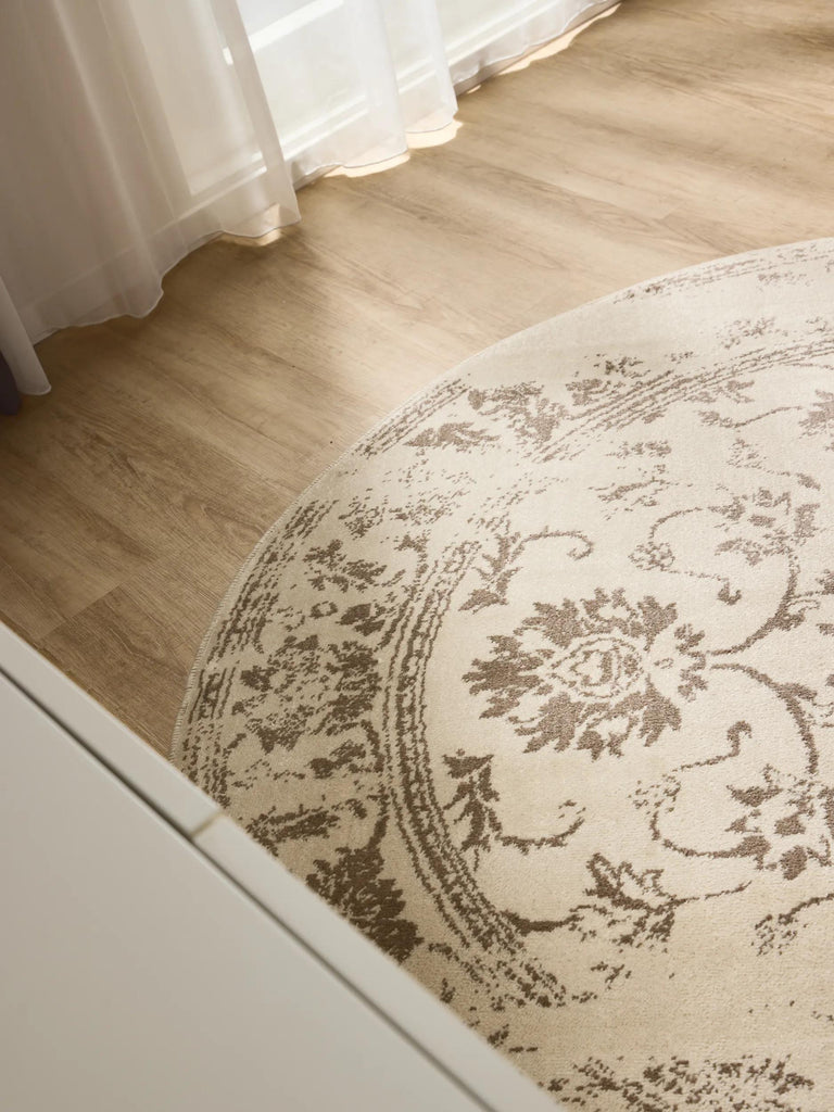 Tapis vintage motif floral rond crème et marron 160 cm de diamètre